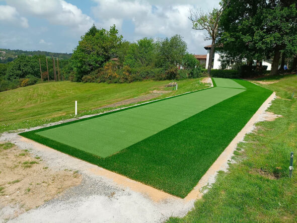 Los Angeles and Southern California Outdoor tee line consisting of one continuous green synthetic grass strip surrounded by trees